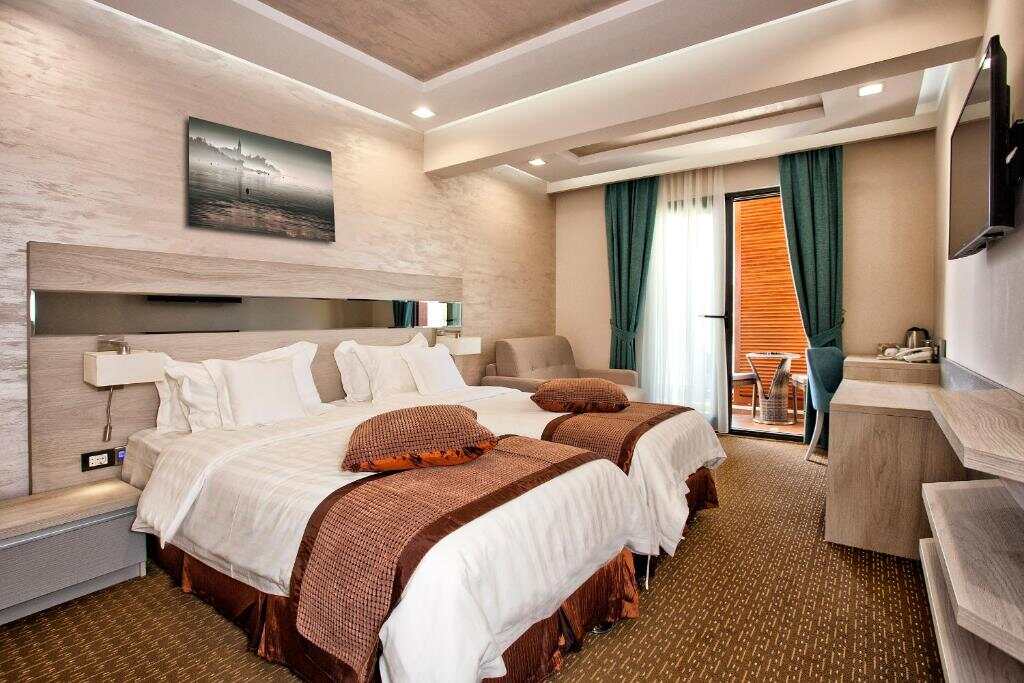 Hotel room with twin beds and balcony access